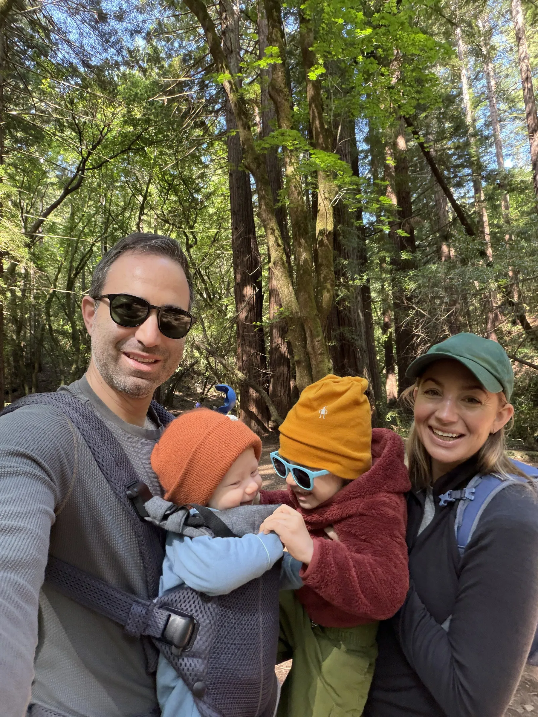 Callie, Patrick, and their two boys hiking in the redwoods
